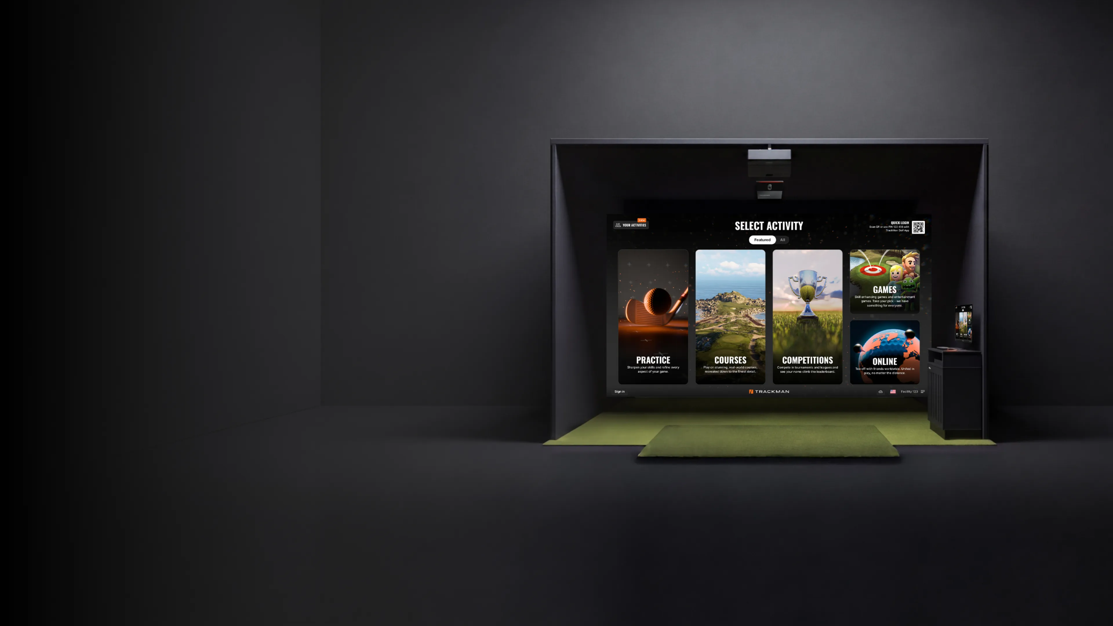 Golf simulator setup with options for practice, courses, competitions, games, and online play on a large screen, set in a dark room.